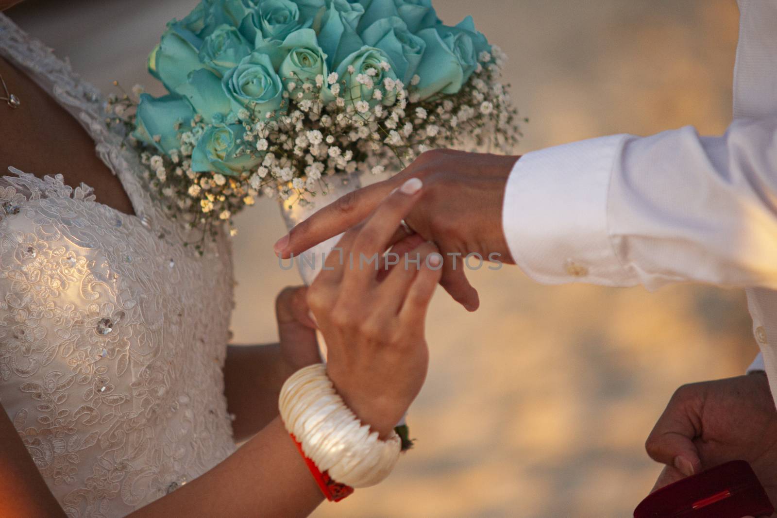 Exchange of wedding rings in caraibic wedding ceremony