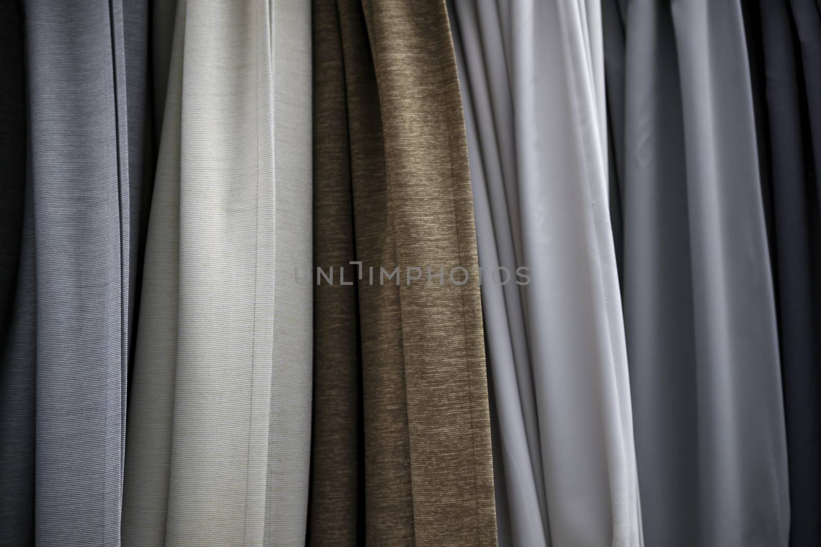 thin bedspreads on the bed of natural linen of different colors. An ecological lifestyle.