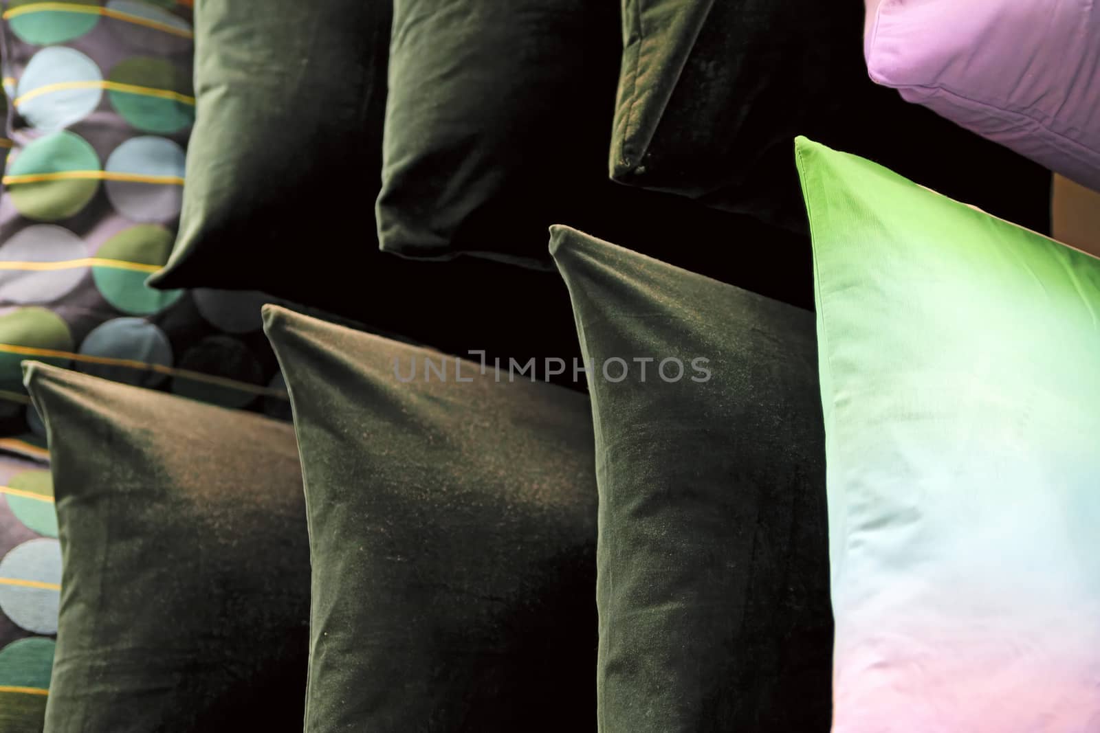 Multi-colored down soft pillows are shot close-up. by bonilook