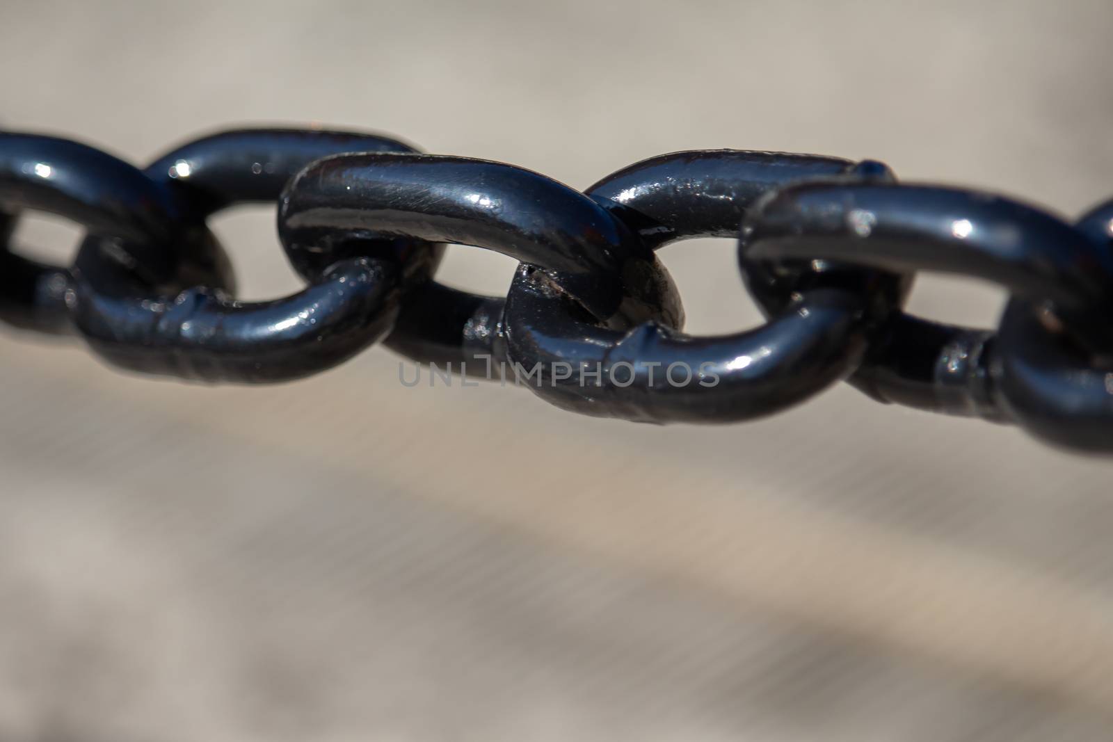 Close-Up of Links in a Painted Black Metal Chain by colintemple