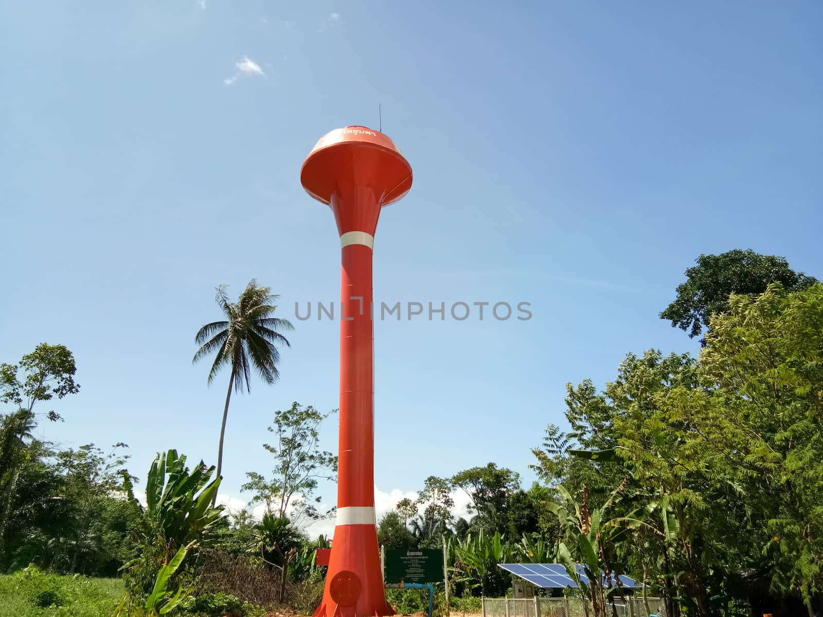 The solar pumping system, Red water tower with blue sky background.