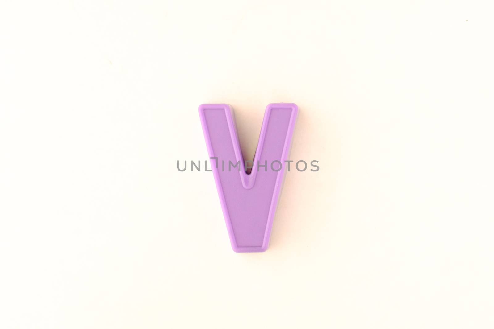 Colorful capital letter over white background