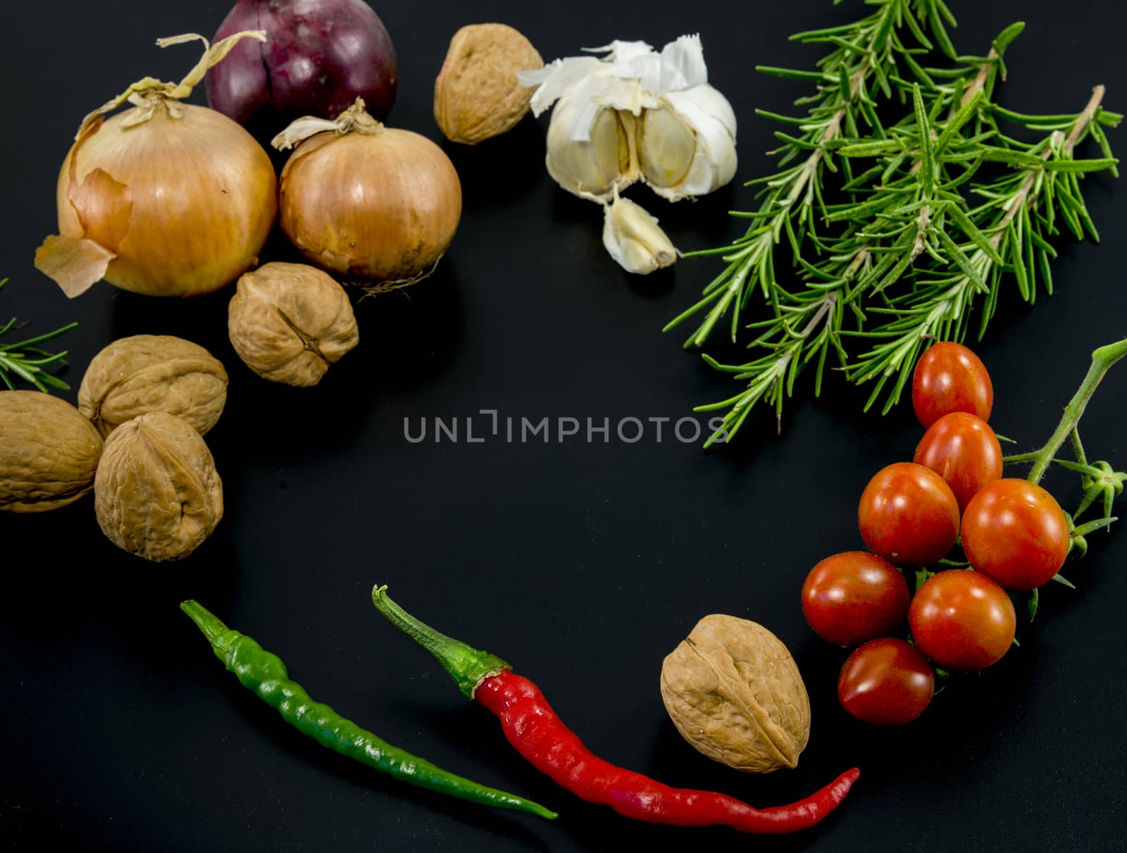 frame of different ingredients foods vegetables and herbs with spce in the middel for text