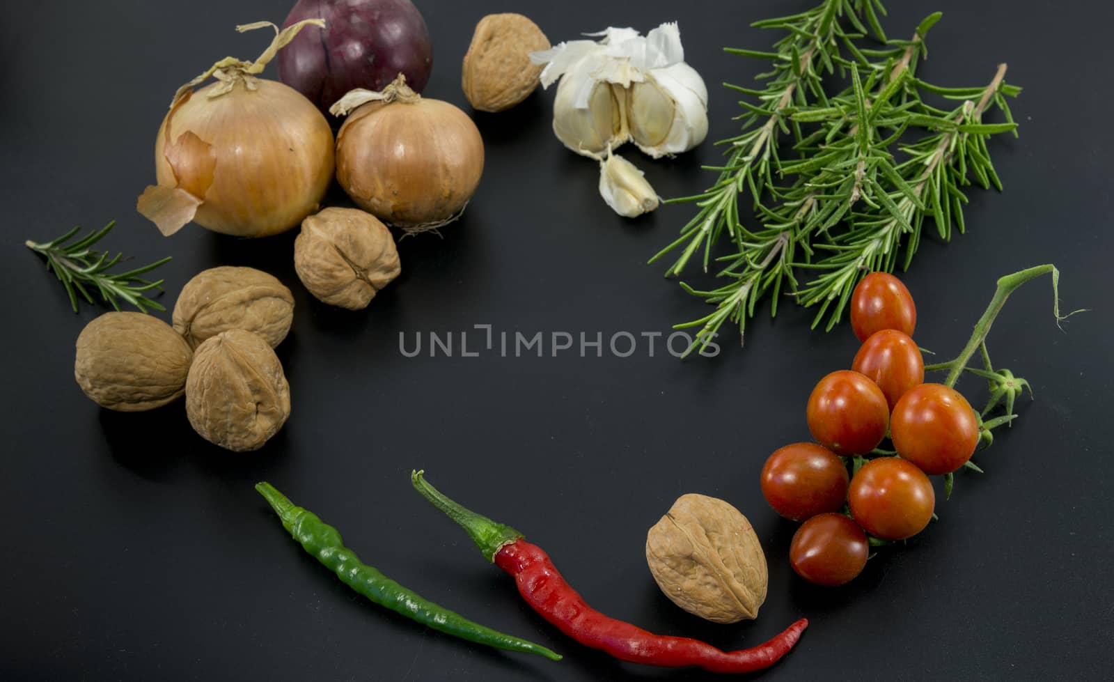 frame of different ingredients foods vegetables and herbs with spce in the middel for text