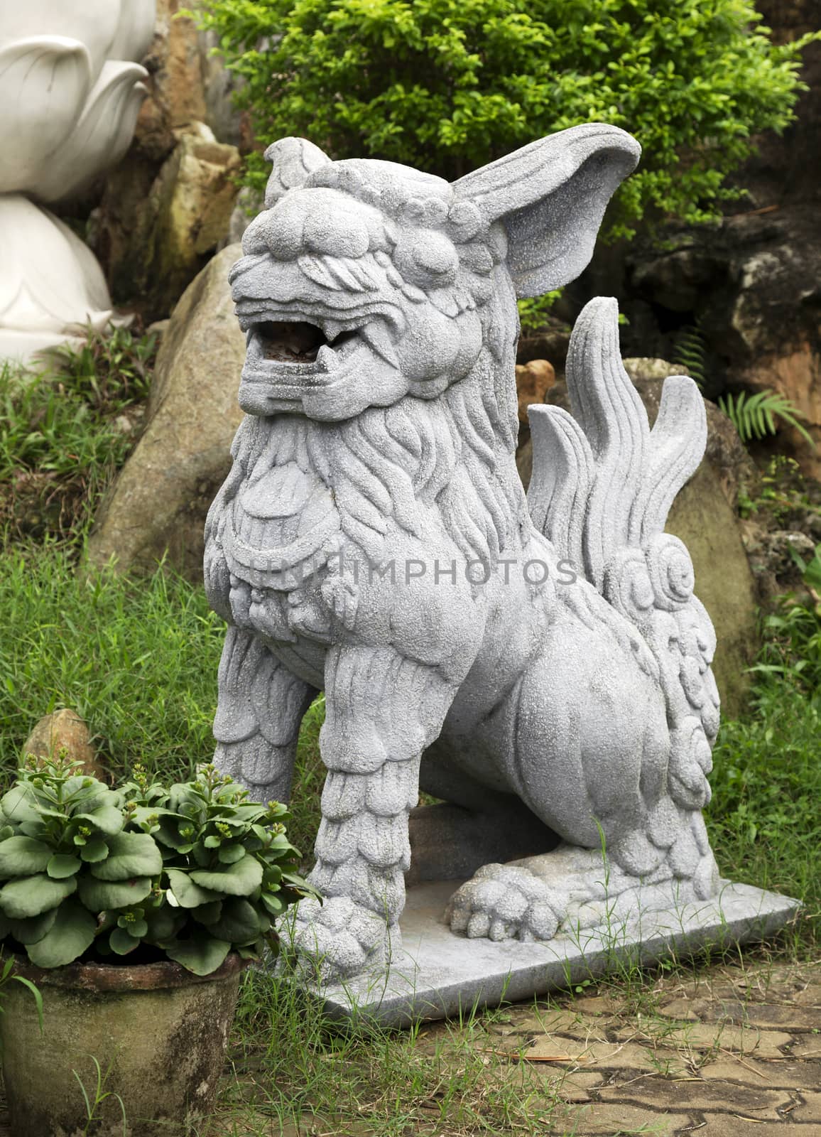 Marble lion at the entrance of a temple, Vietnam