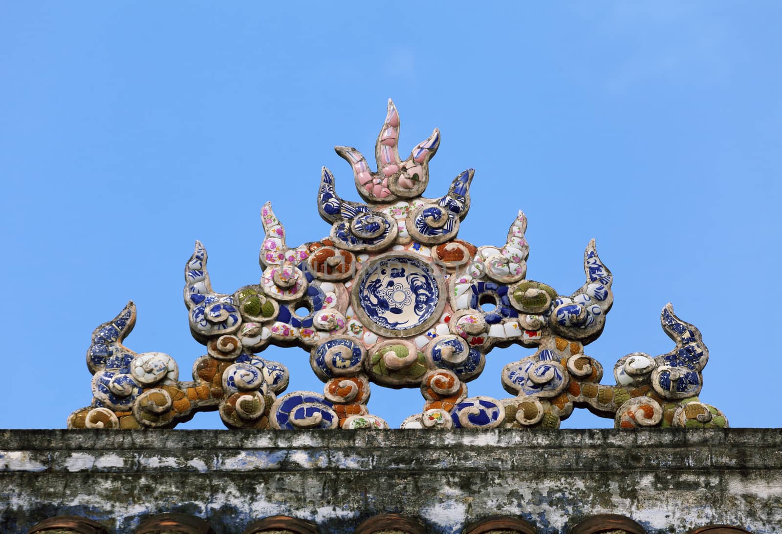 Decoration on a temple roof in Vietnam by Goodday