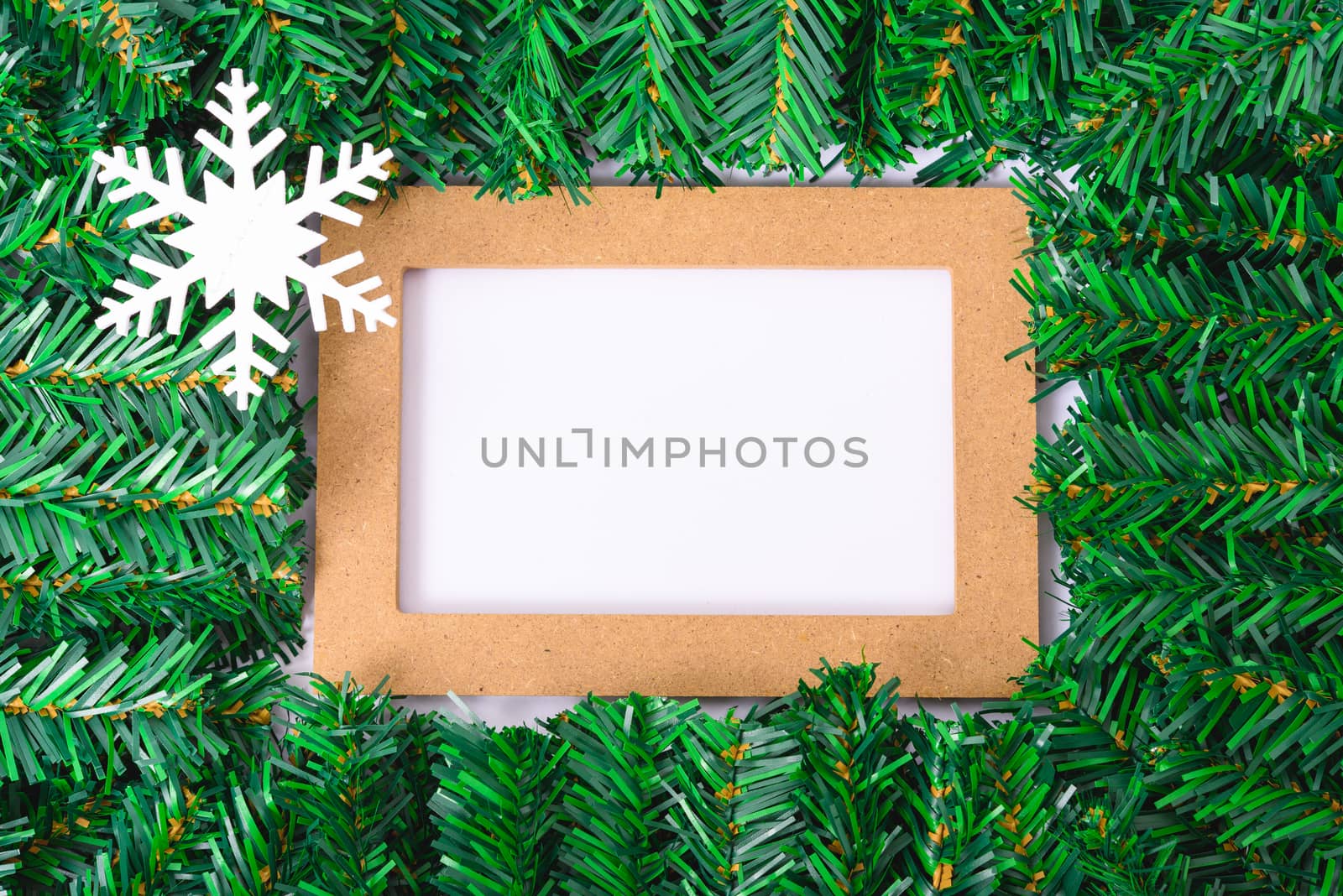 Happy New Year and Christmas day, top view flat lay composition decoration branches tree photo frame on white background with copy space for your text