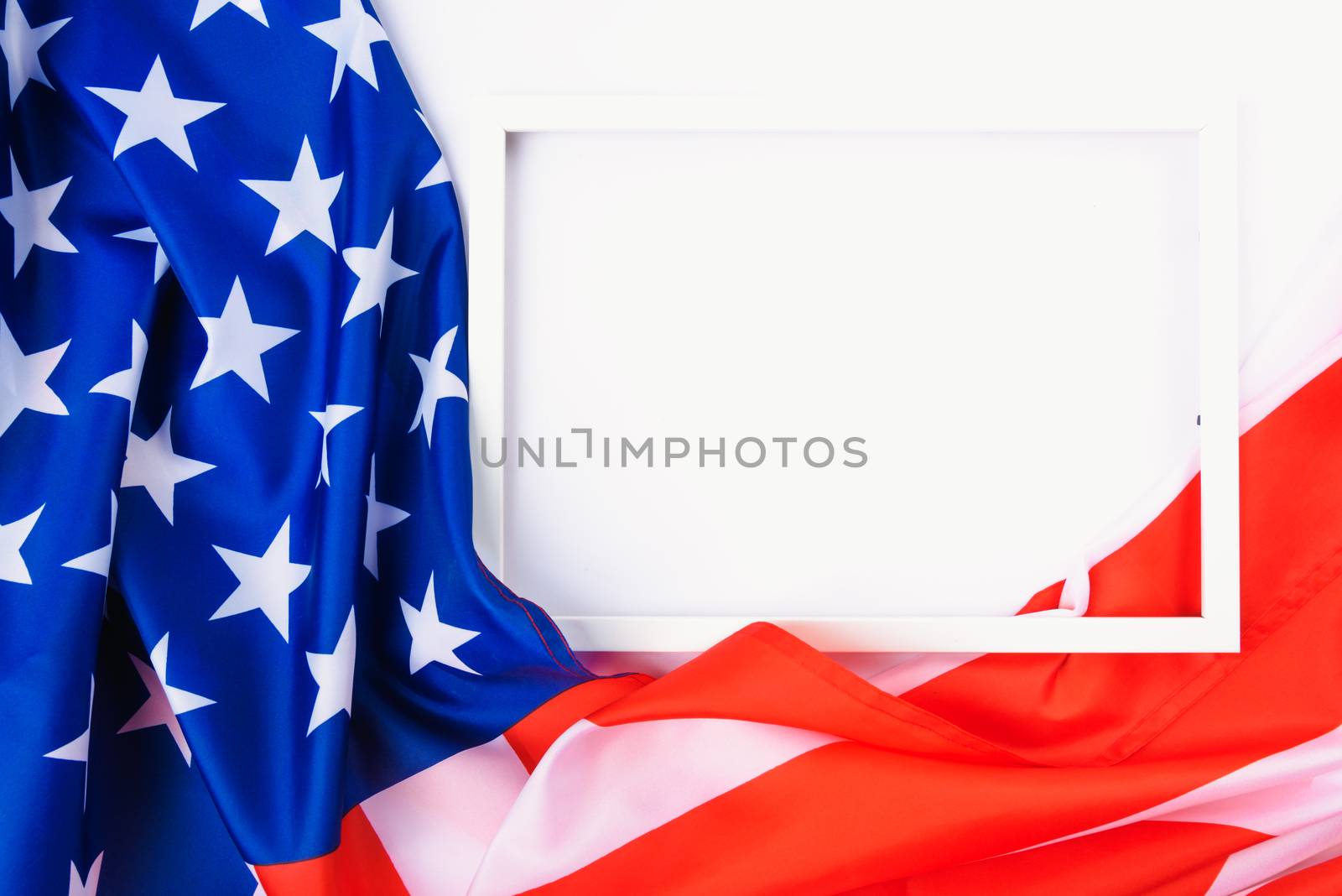 Martin luther king day, flat lay top view, American flag and photo frame on white background with copy space for your text