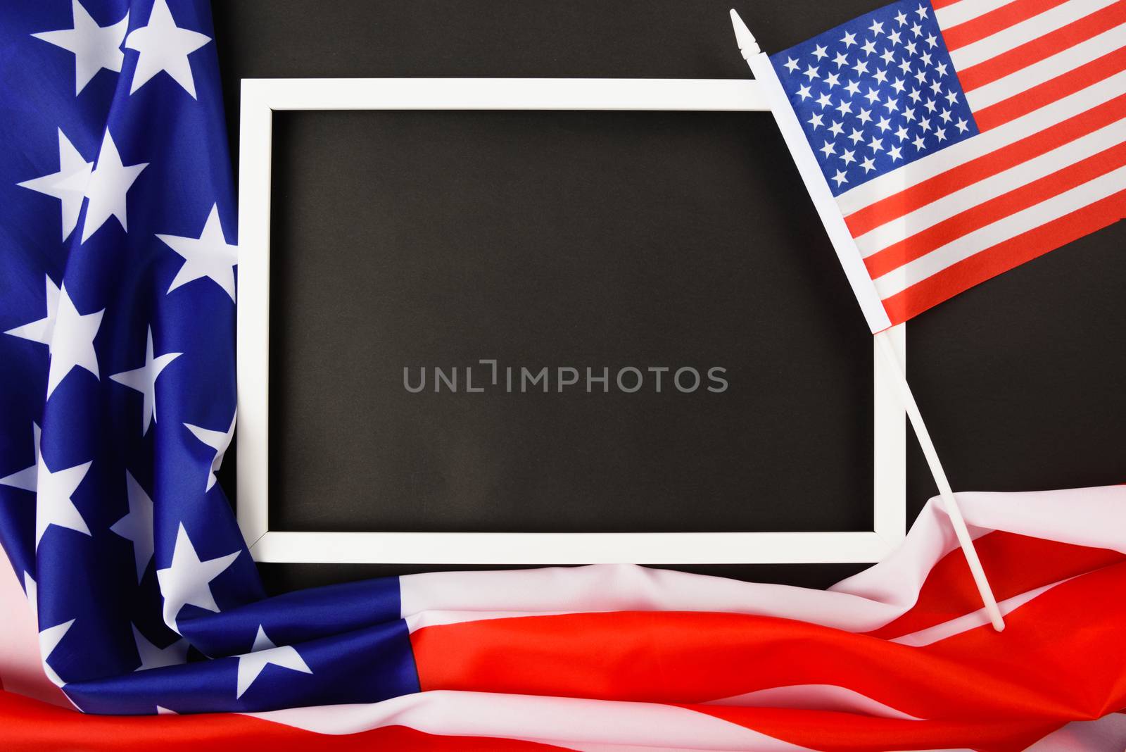 Martin luther king day, flat lay top view, American flag and photo frame on black background with copy space for your text