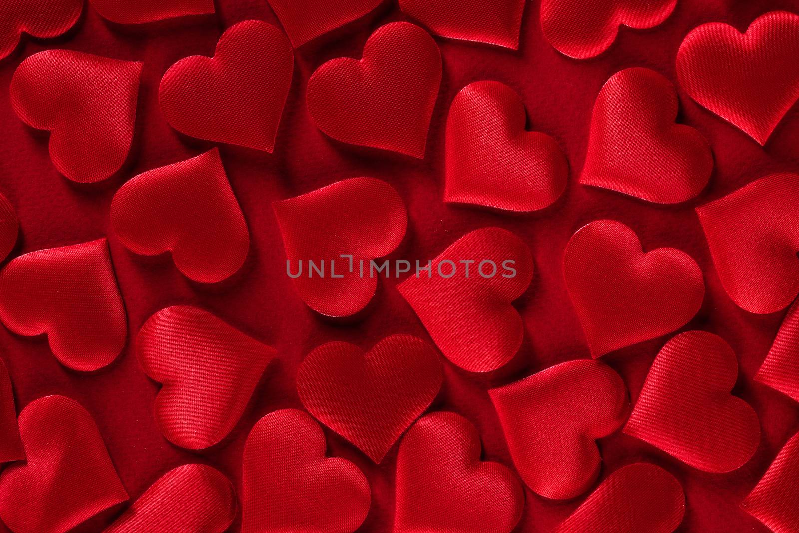 Valentine's day many red silk hearts background, love concept