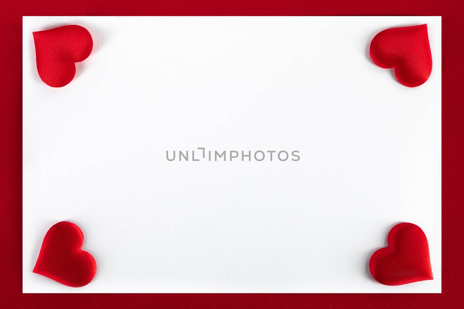 Valentine's day red silk hearts, background border frame with white card with copy space, love concept