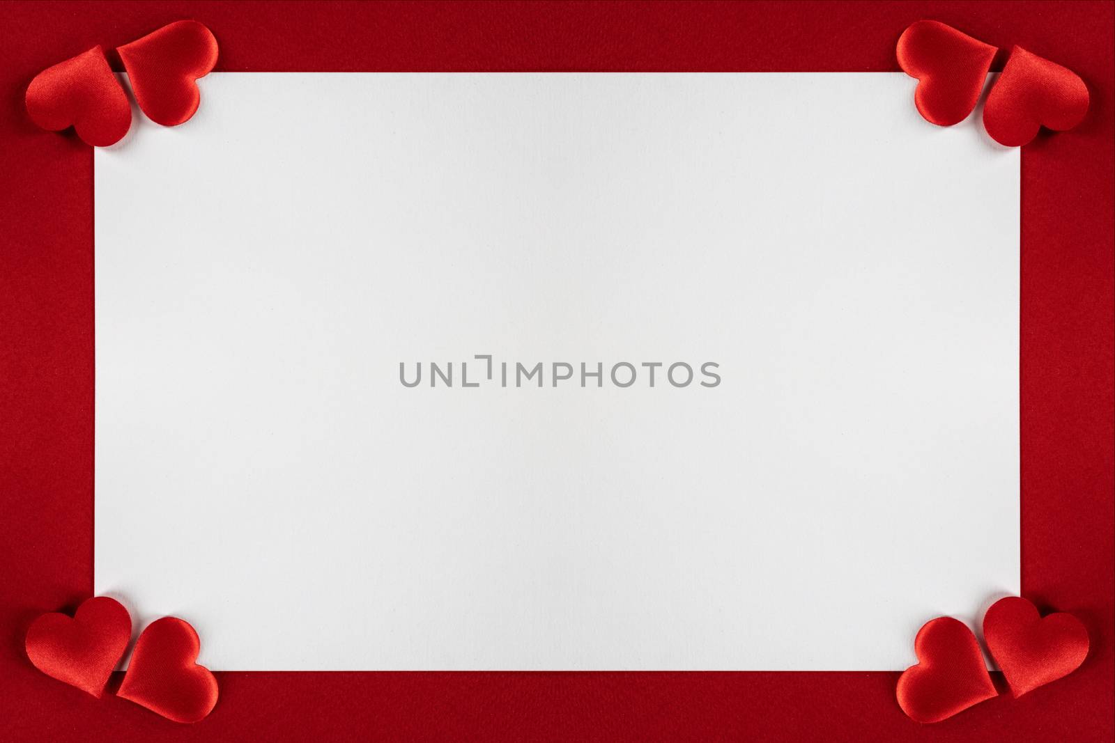 Valentine's day red silk hearts, background border frame with white card with copy space, love concept