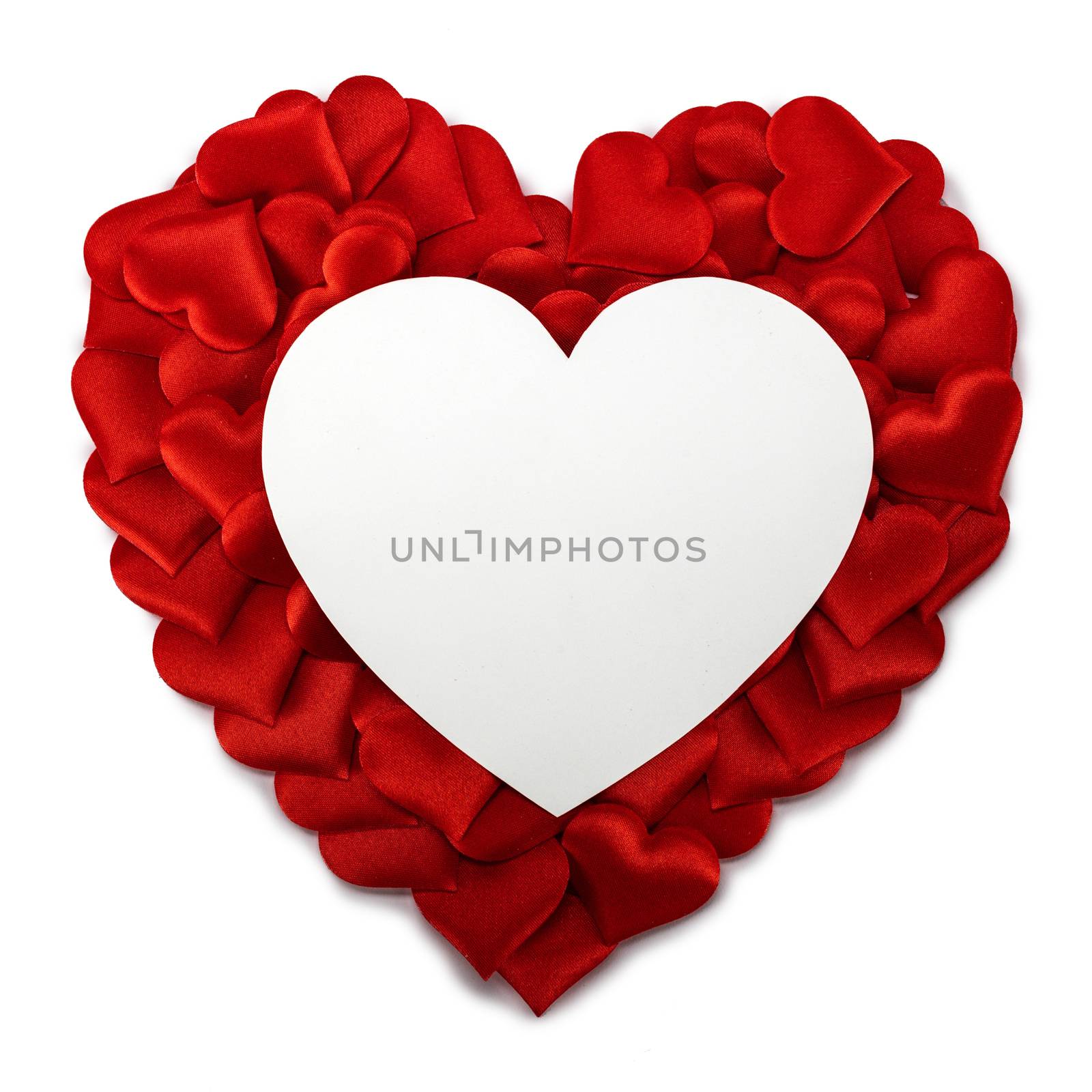 Valentine's day many red silk hearts and heart shaped card isolated on white background, love concept