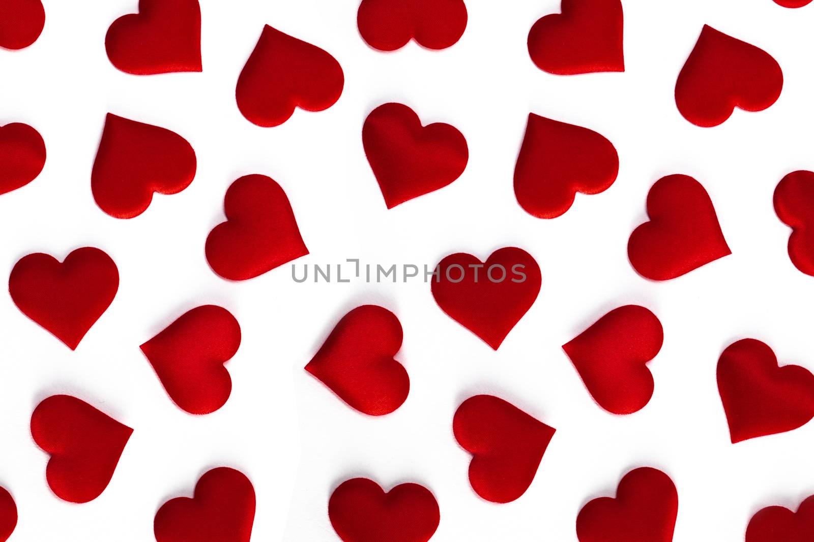 Valentine's day many red silk hearts isolated on white background, love concept