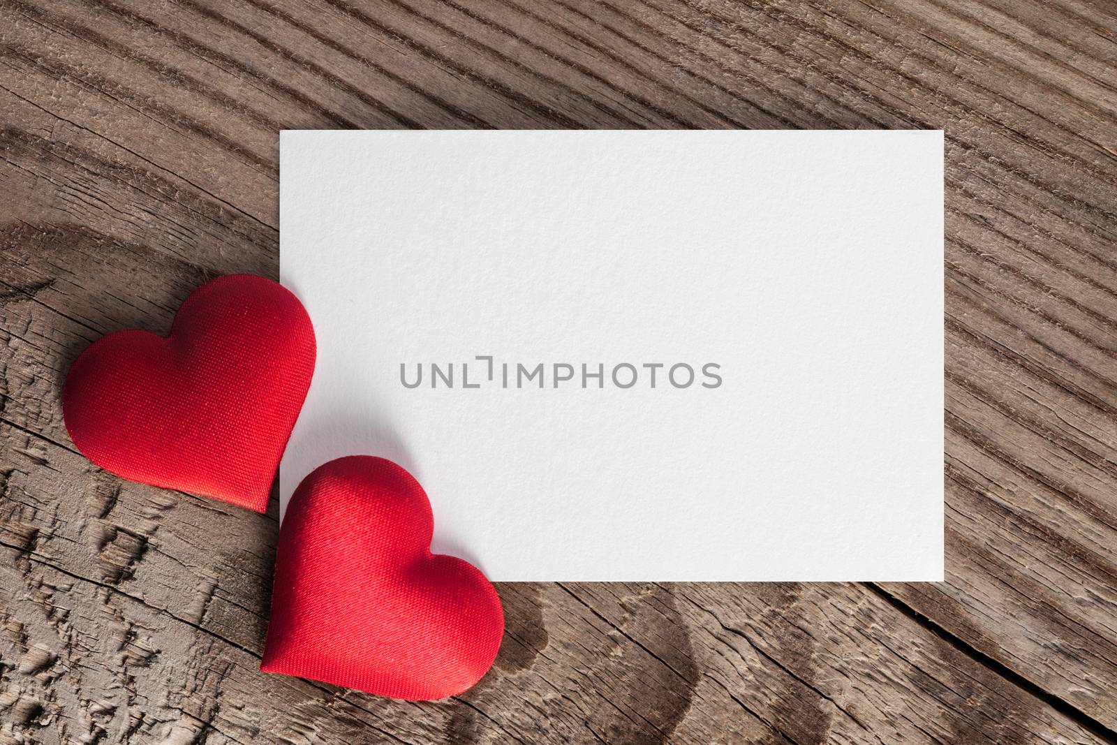 Valentine's day white blank paper greeting card and red silk hearts, background border frame with copy space, love concept