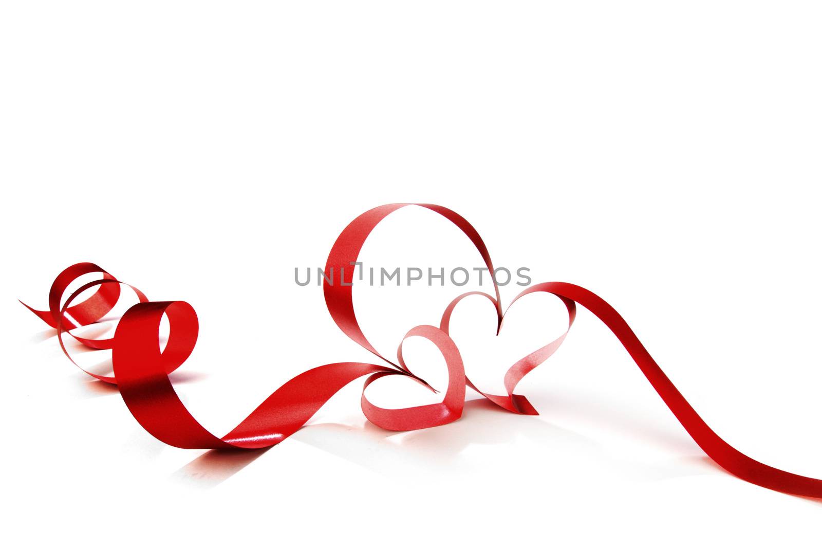 Hearts from red ribbon isolated on white background