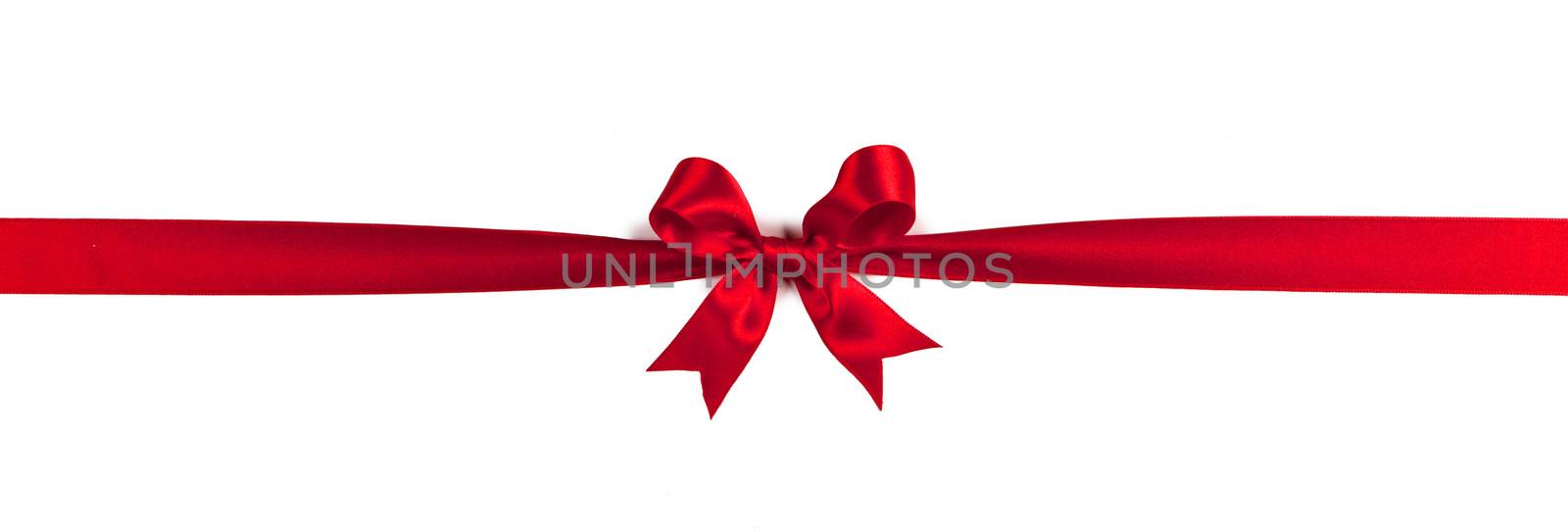 Red ribbon bow isolated on white by Yellowj
