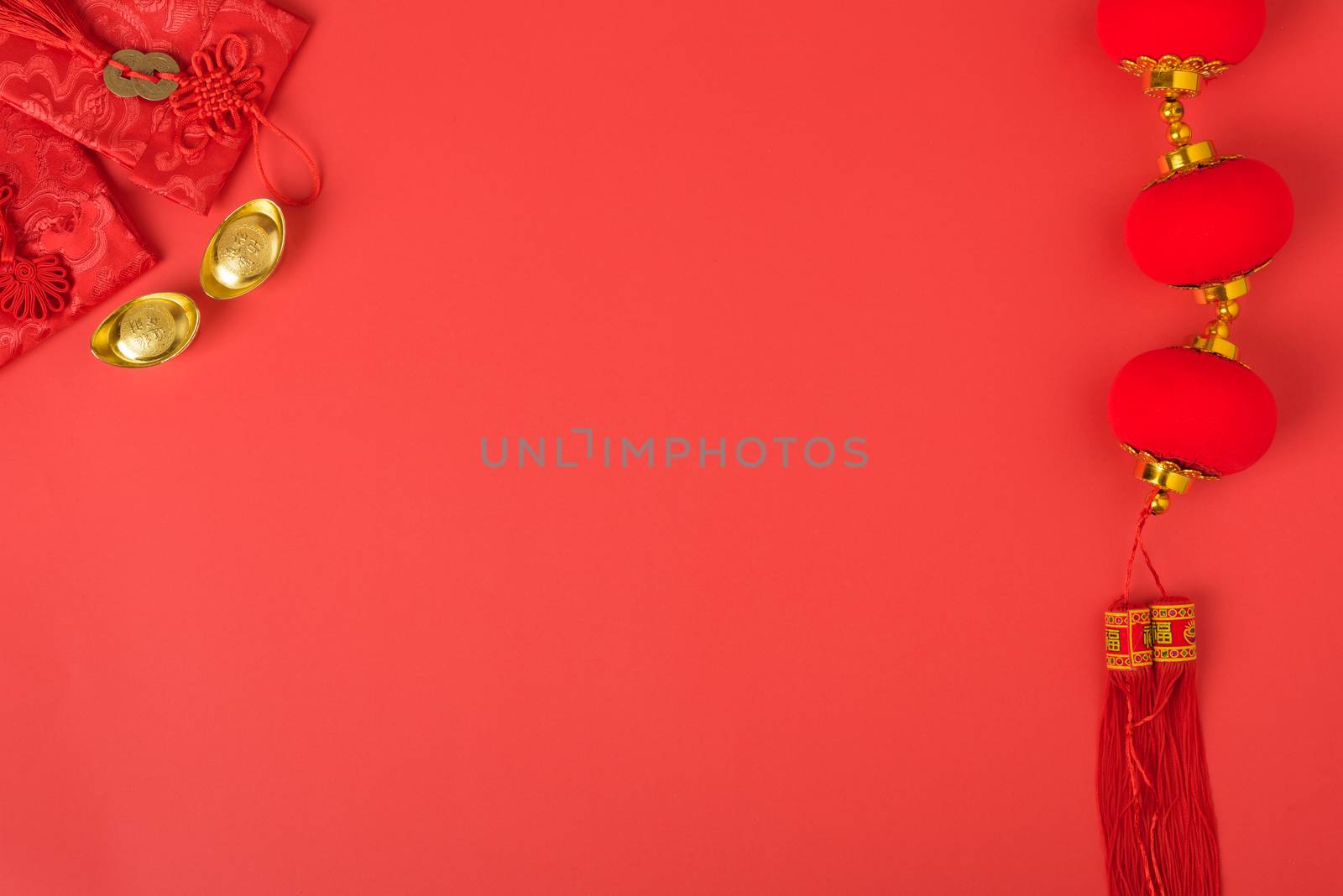 Chinese new year concept, flat lay top view, Happy Chinese new year with Red envelope and gold ingot (Character "FU" means fortune, blessing, wealth) on red background with copy space for your text
