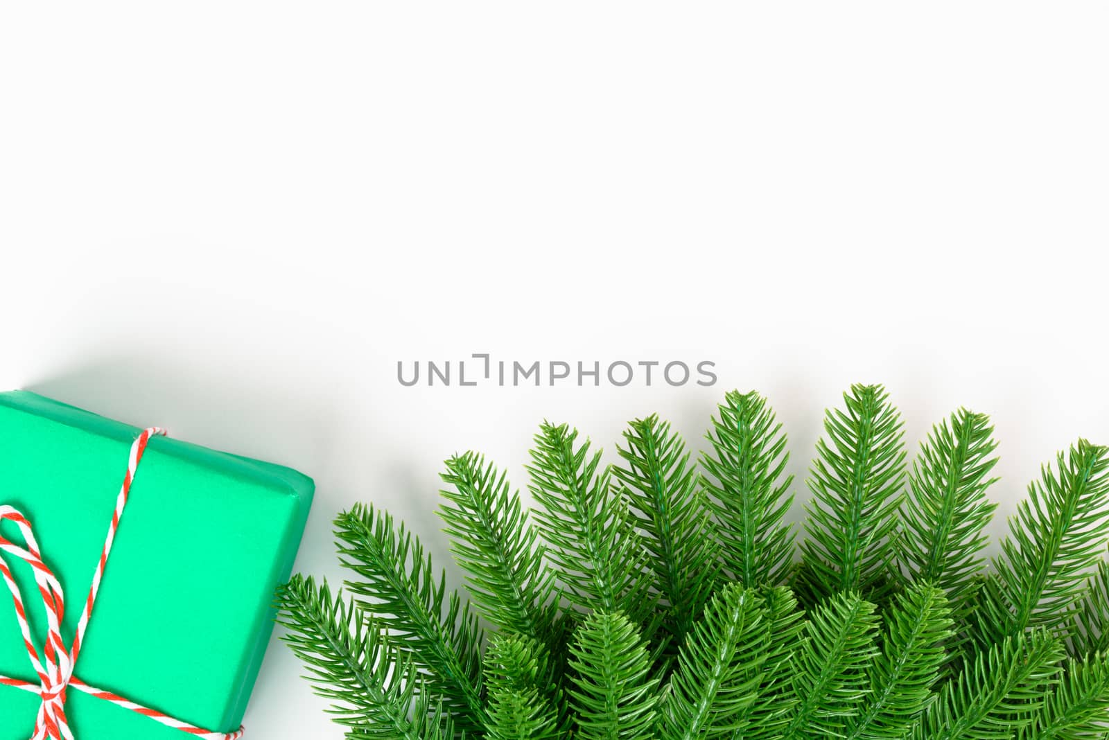 Happy new year or christmas day top view decorative fir tree and gift box on white background with copy space for your text
