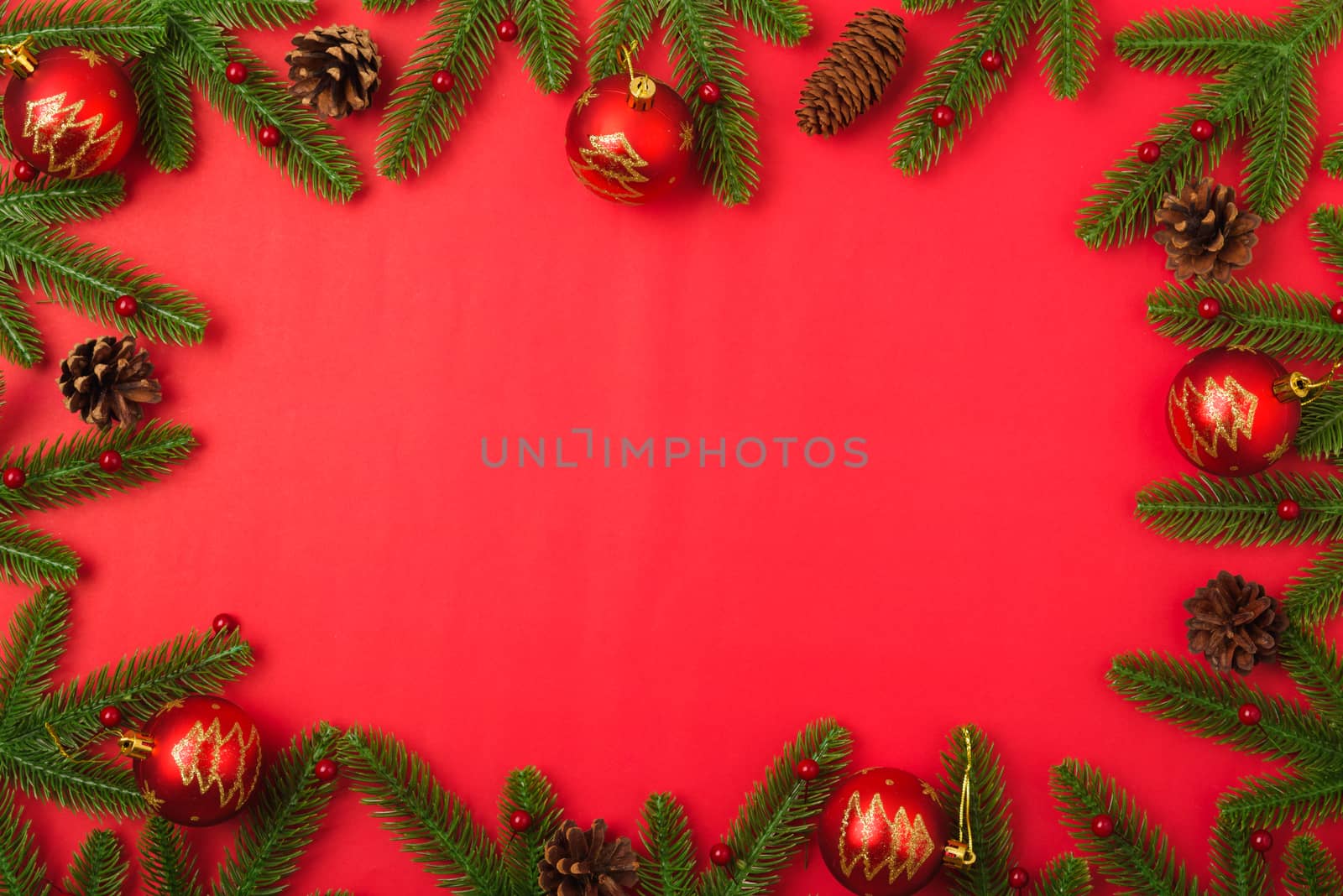 Happy new year or christmas day top view flat lay fir tree branches and decoration on red background with copy space for your text