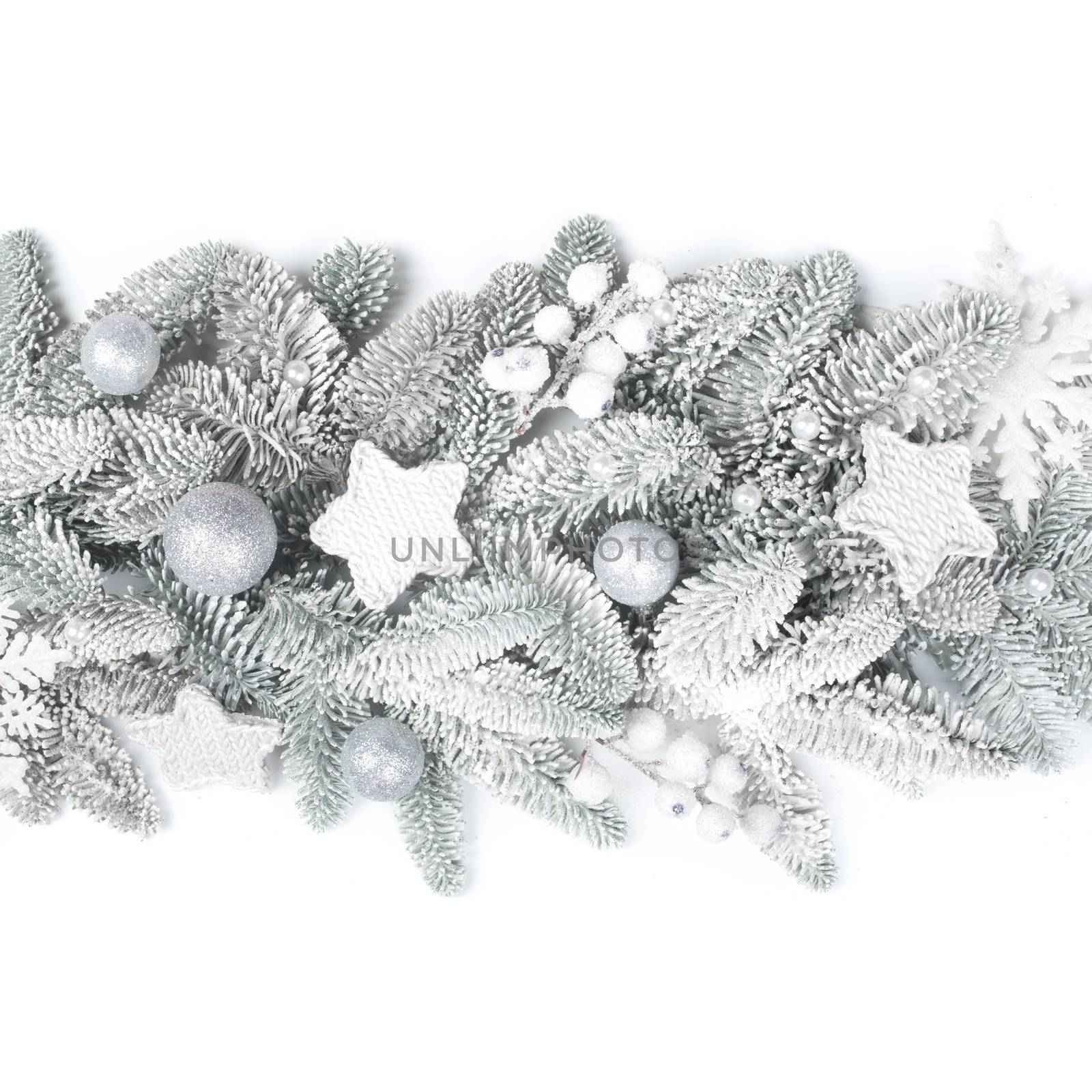 Frosted fir tree twigs and Christmas decorative bauble balls isolated on white background with copy space for text template flat lay top view design