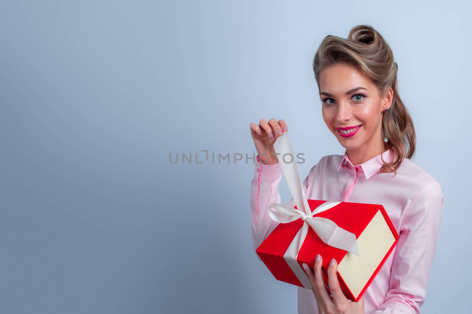 Happy woman with gift by ALotOfPeople