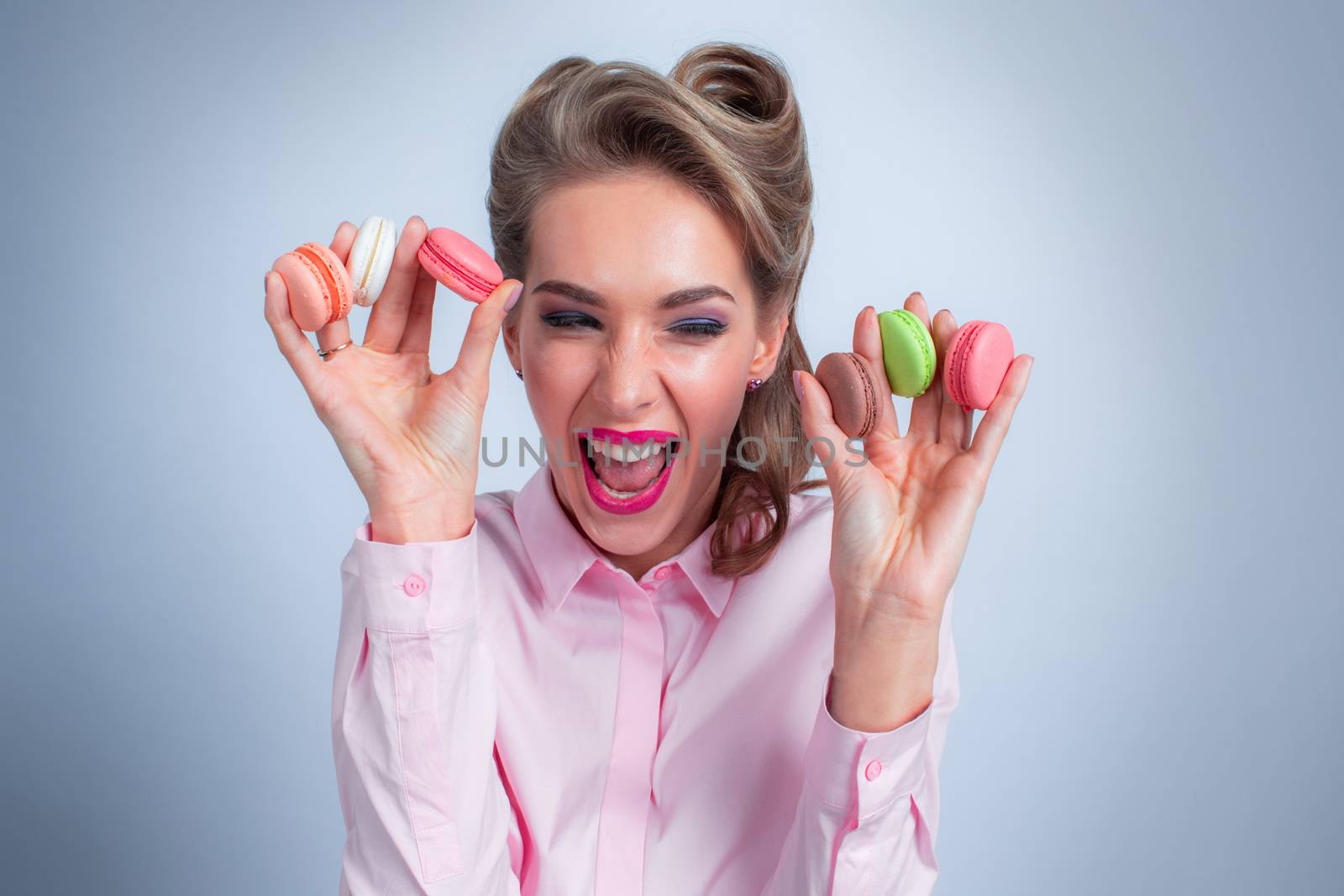 Woman eating macaroons by ALotOfPeople