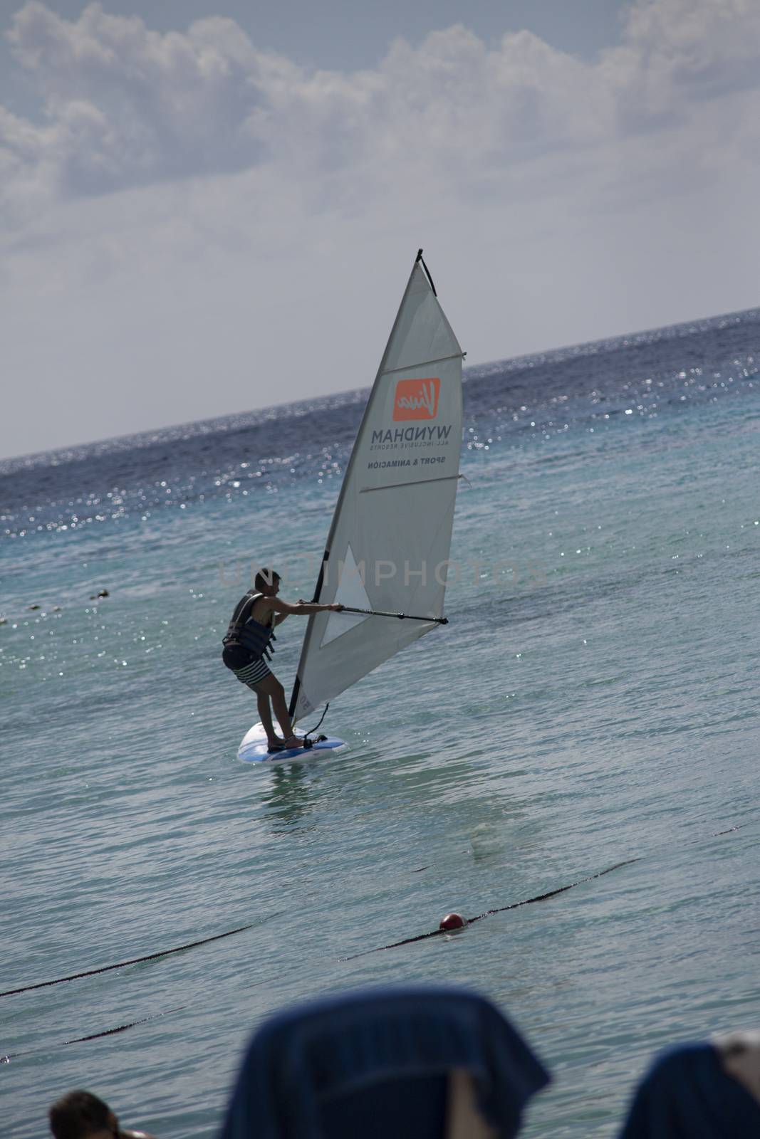 BAYAHIBE, DOMINICAN REPUBLIC 13 DECEMBER 2019: Windsurfer on caribbean sea