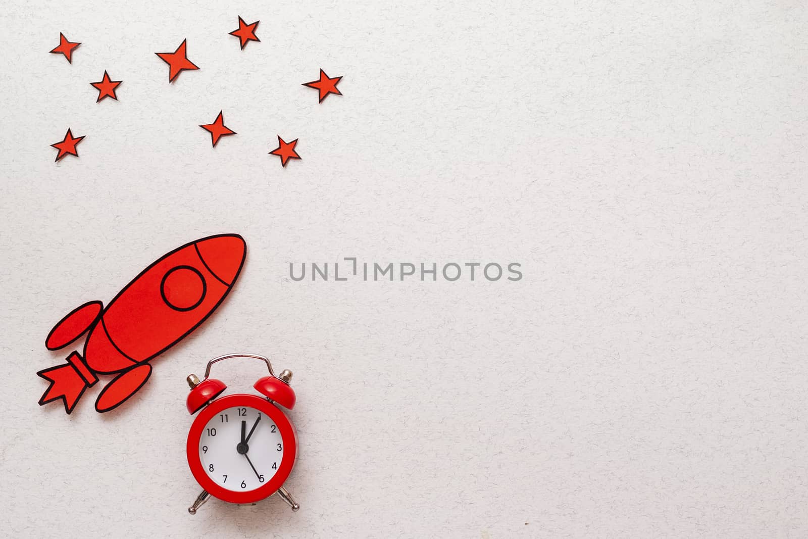 Red rocket border with alarm clock and stars by sergii_gnatiuk