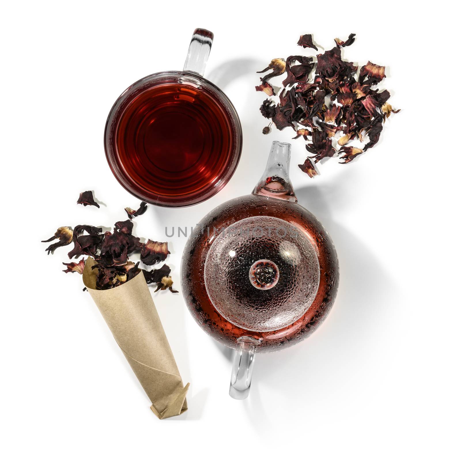 Hibiscus tea and beverage accessories on white background.