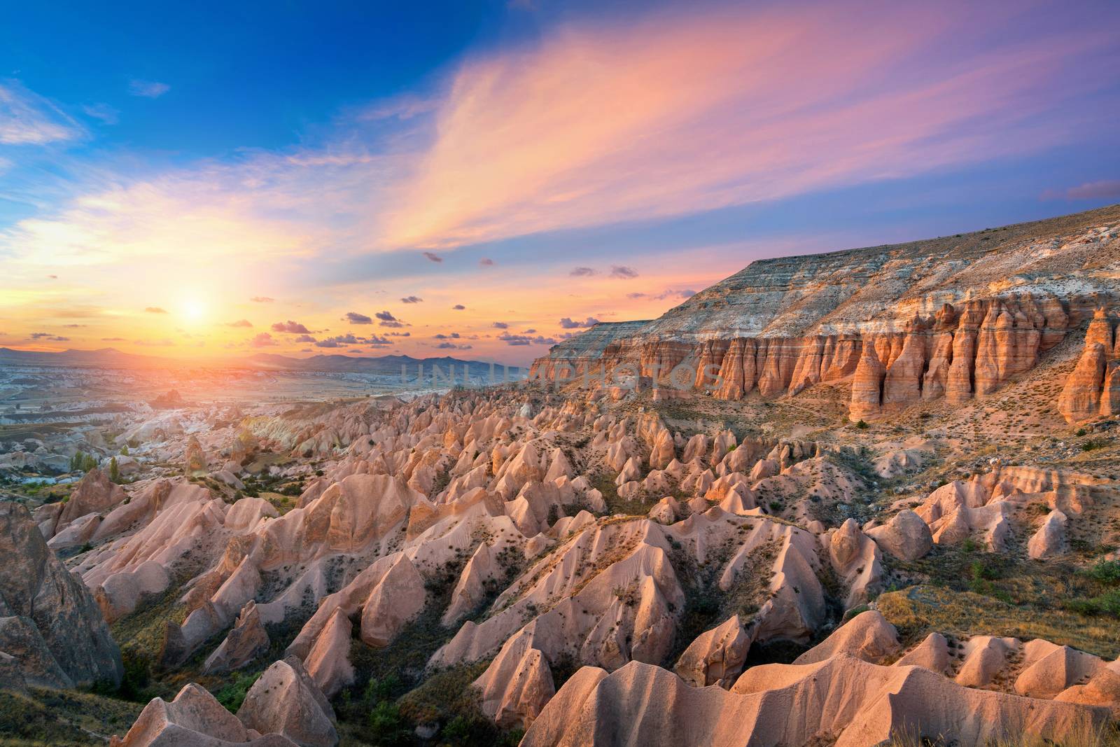 Beautiful mountains and Red valley  at sunset in Goreme, Cappadocia in Turkey. by gutarphotoghaphy