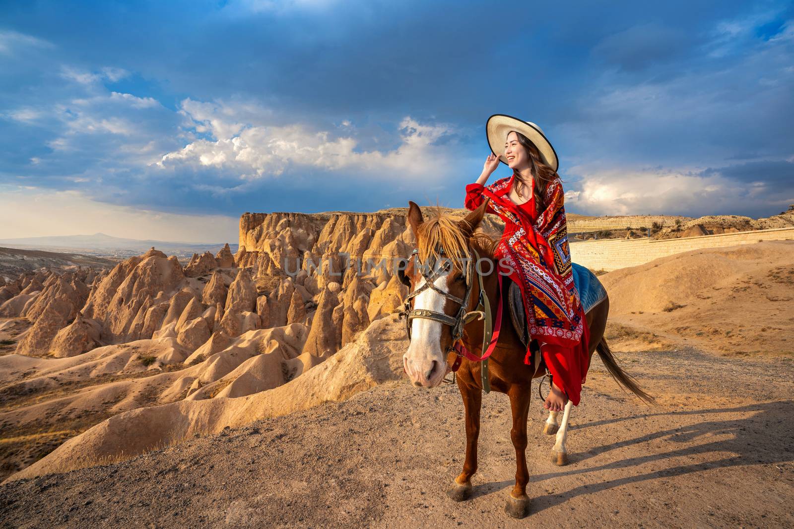 Tourists enjoy ride horses in Cappadocia, Turkey by gutarphotoghaphy