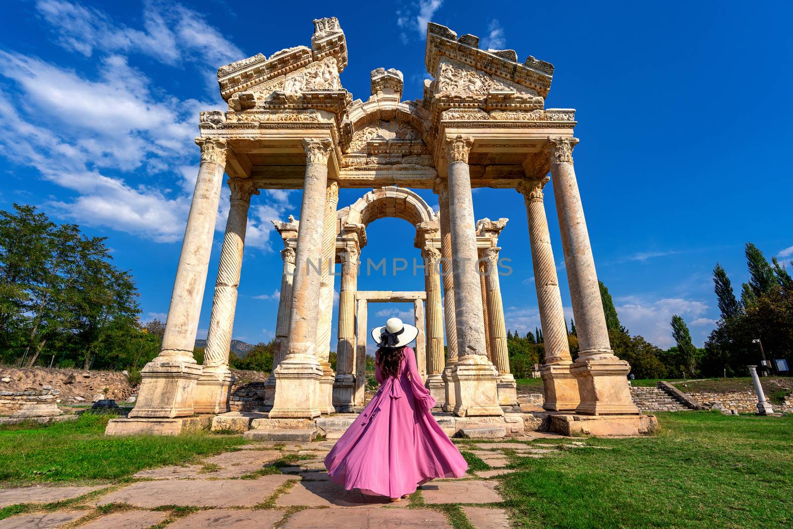 Beautiful girl walking at Aphrodisias ancient city in Turkey.