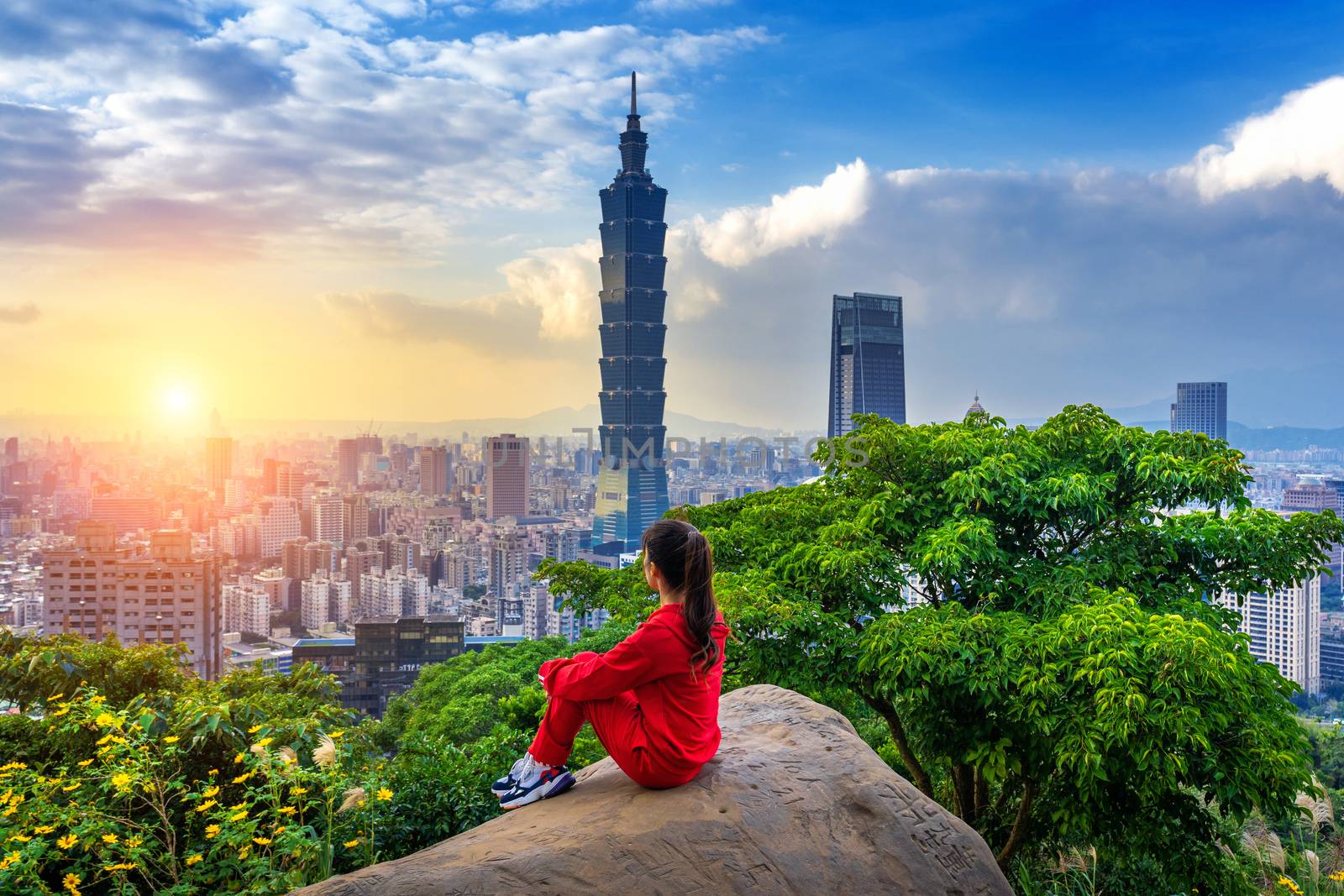 Tourist woman enjoying view on mountains in Taipei, Taiwan.