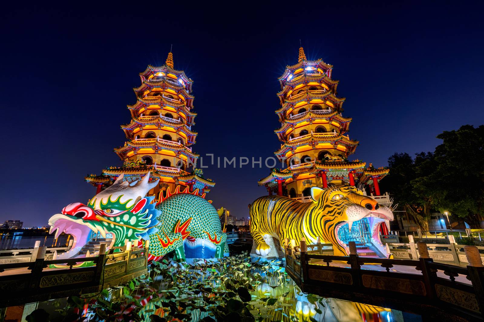 Dragon and Tiger Pagodas at night in Kaohsiung, Taiwan. by gutarphotoghaphy