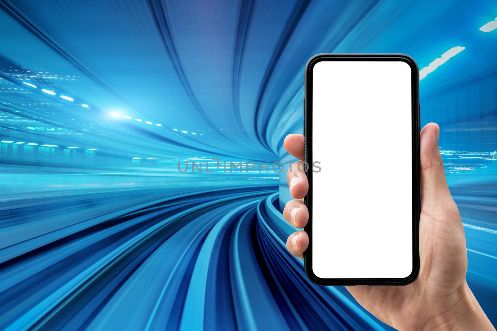 Hand holding smartphone with blue motion blur background.