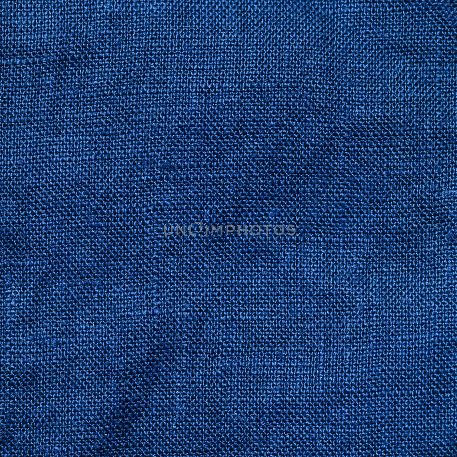 Abstract extreme close up linen textured background made of classic blue 2020 color. Color of year 2020 linen textile backdrop. COY2020 concept. Copy space for text. Square crop