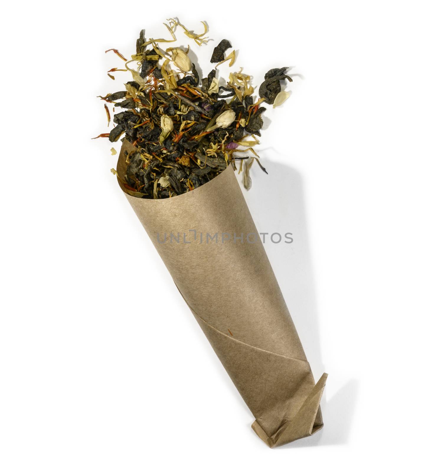 Green tea with aromatic additives. Top view on white background.