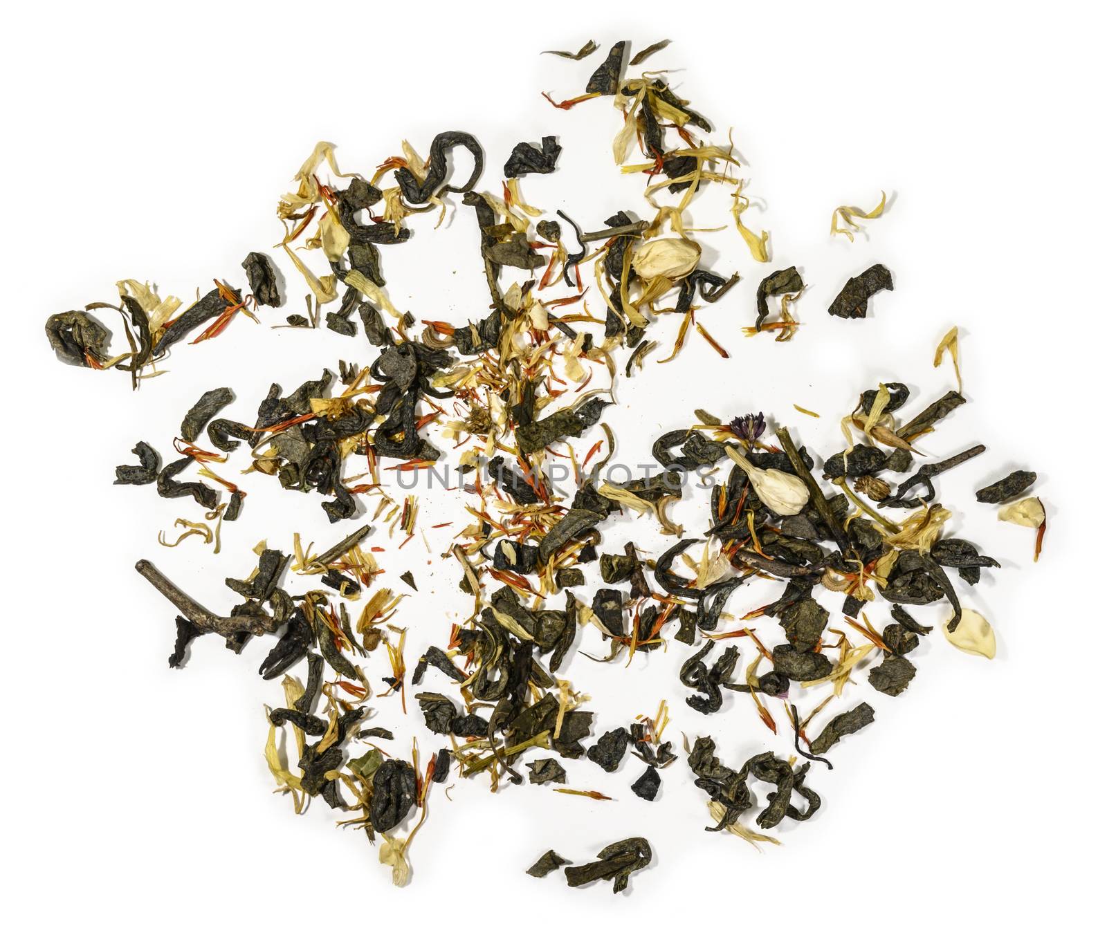 Green tea with aromatic additives. Top view on white background.
