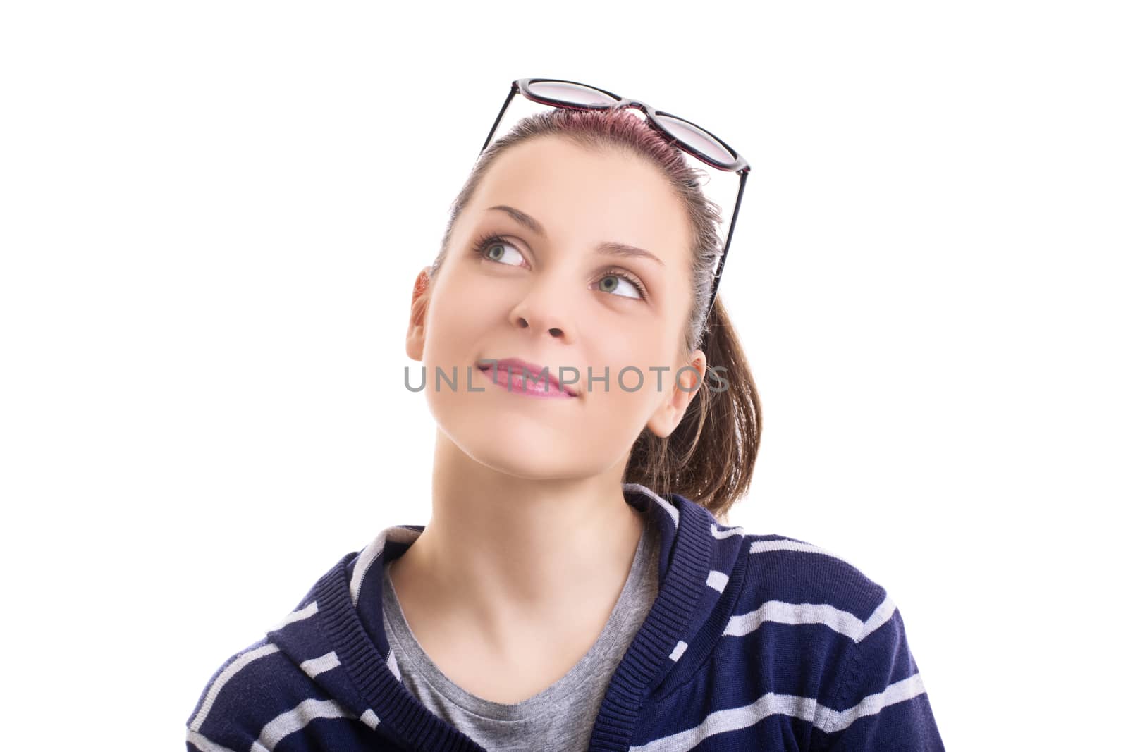 Close up of a beautiful young smiling girl with sunglasses looking up, isolated on white background. Beautiful girl looking to the side, thinking and smiling.