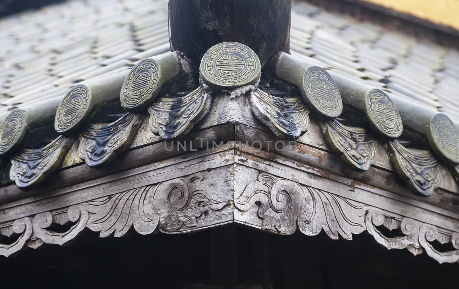 Close up of roof of Buddhist temple, Vietnam, with longevity symbols