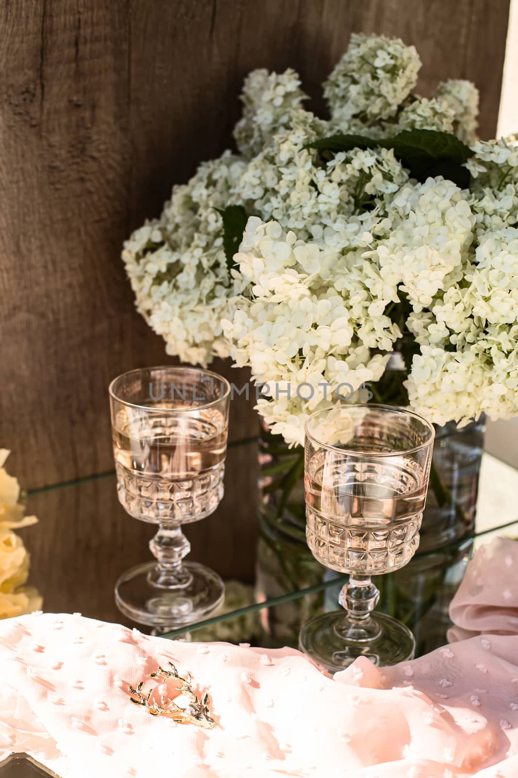 Rose blush wine in glasses. Bottle of rose wine with flowers on background. Prosecco. by Denys_N