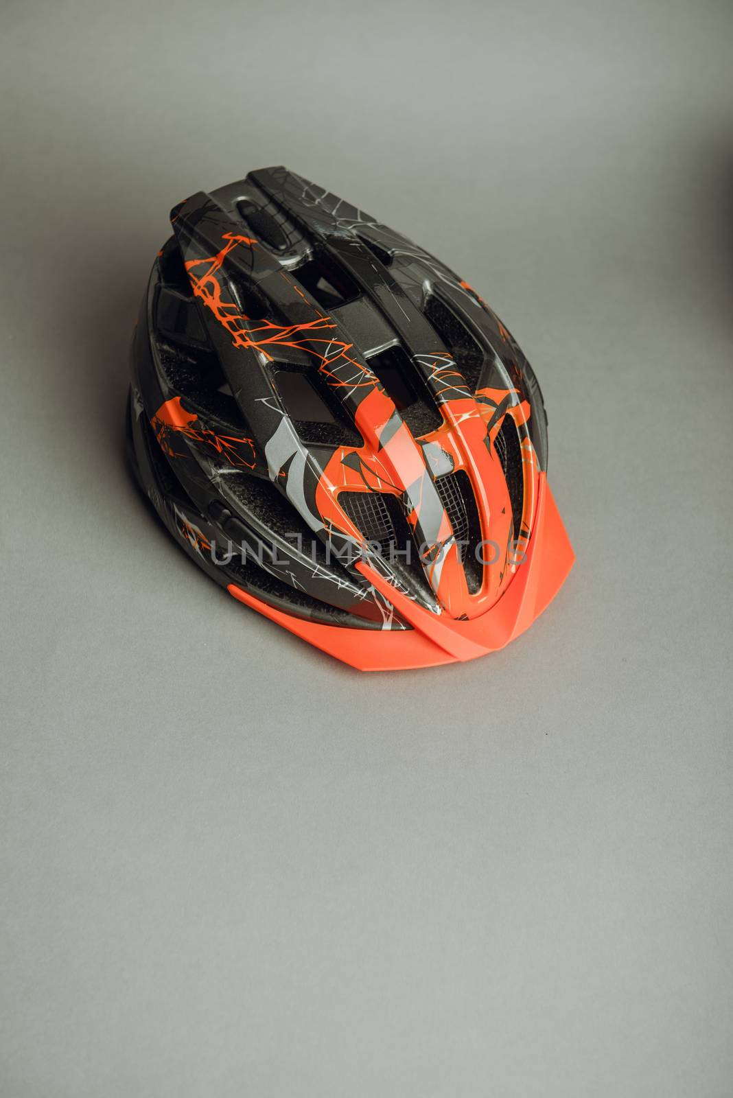 Helmet, gloves, shoes and water bottle - bicycle accessories. Orange color