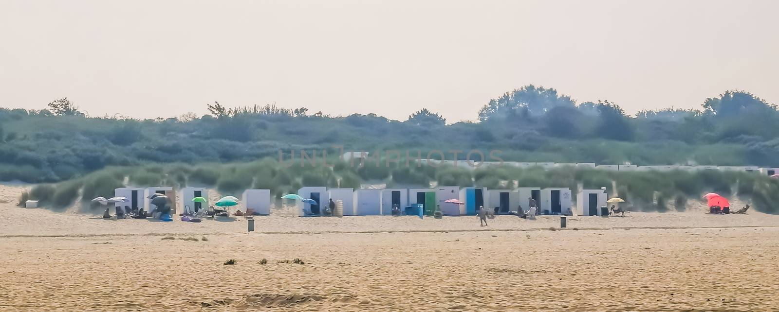 beach cottages at the coast of vrouwenpolder, Zeeland, The Netherlands by charlottebleijenberg