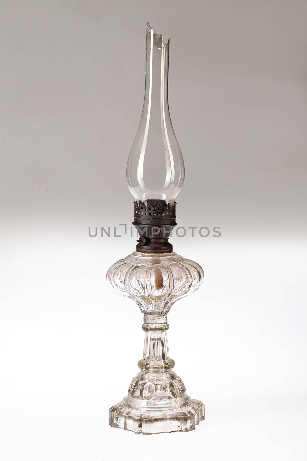 Old oil lamp on an isolated studio background