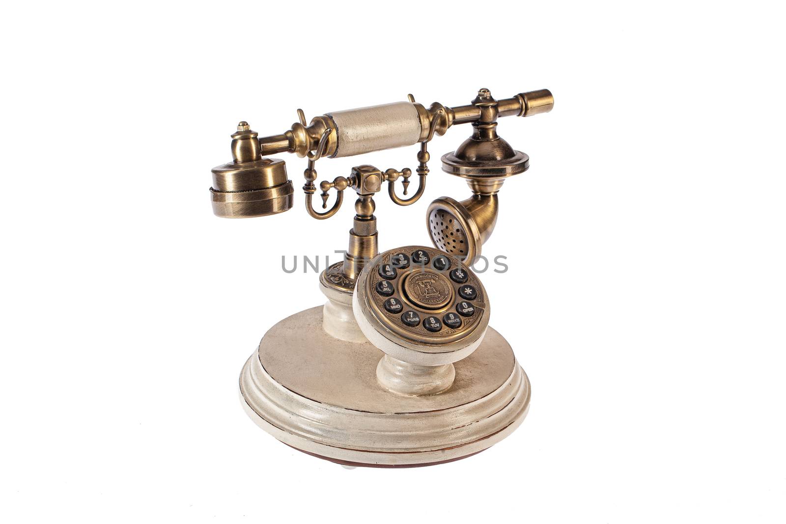 Old telephone on an isolated studio background