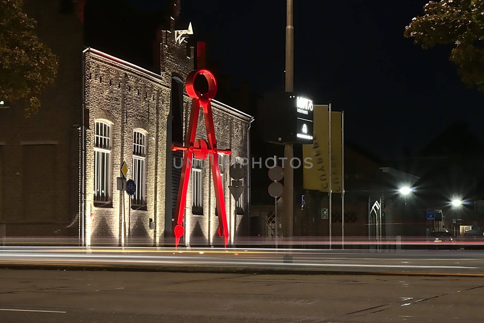 This giant pair of compasses is in front of the Cuypershuis in Roermond, a museum in honor of the work of the great architect Cuypers who lived in Roermond at the place where the museum is now. Shot in the summer at night with a long exposure.