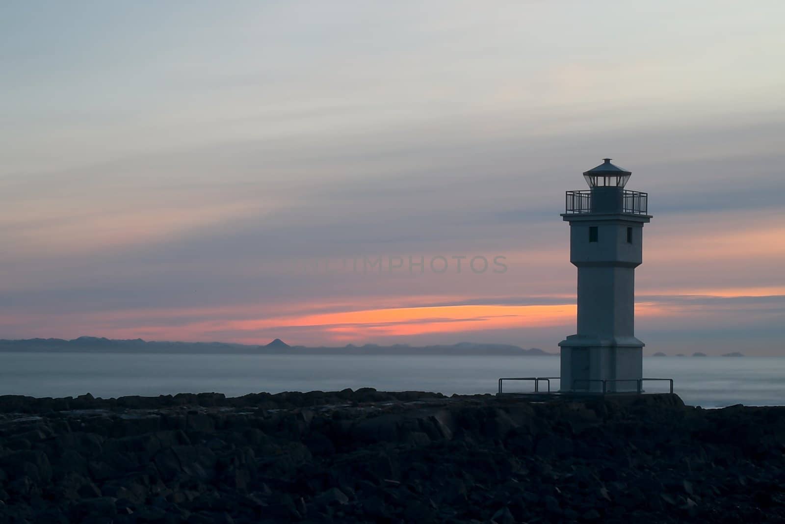 The famous lighthouse in Akranes, Iceland during the sunset during the autumn.