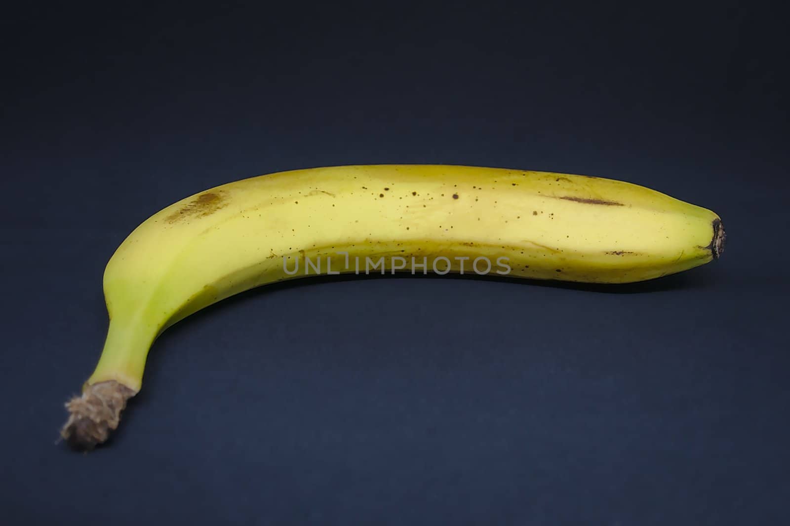 A simple banana with a black background