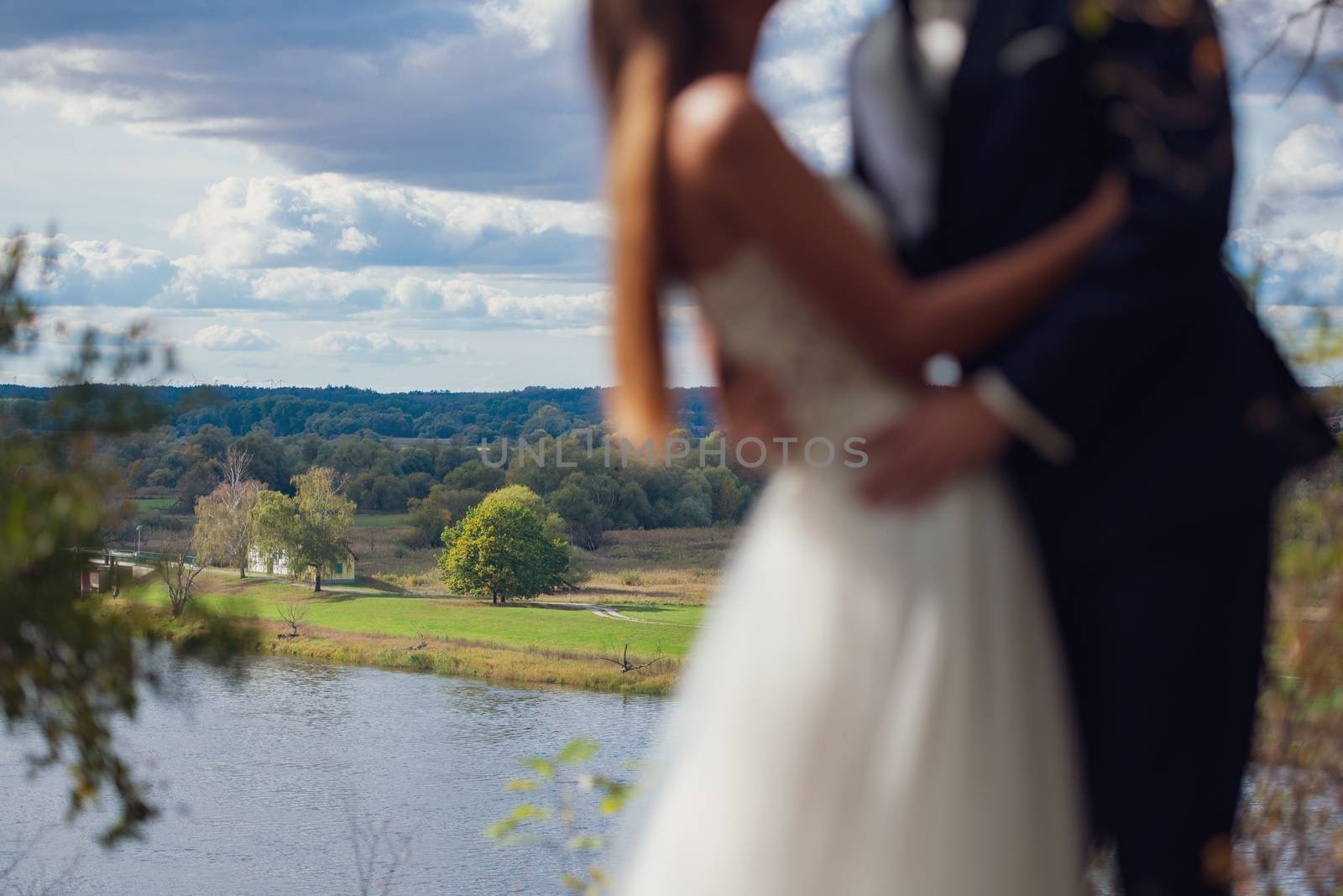 Bride and groom at a photo session in the nature.